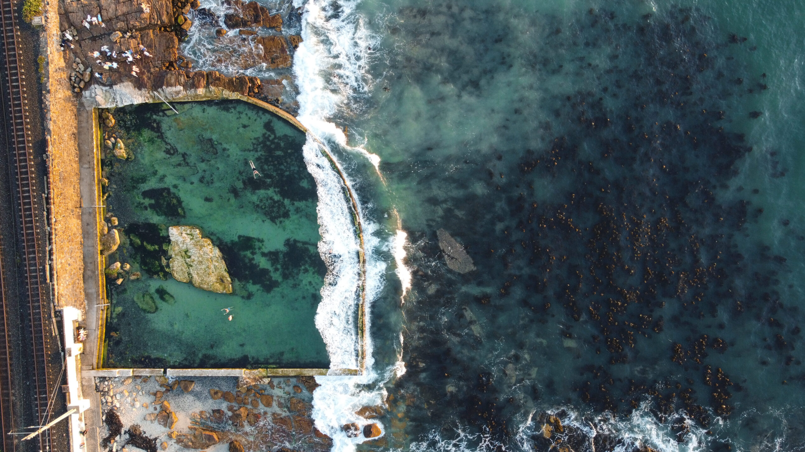 The Dalebrook Place heritage building set above the Dalebrook tidal pool, Kalk Bay seafront